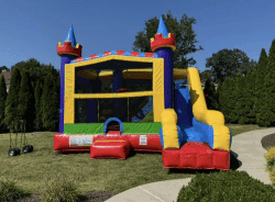 Inflatable bounce house with slide, perfect for children's parties and outdoor events.
